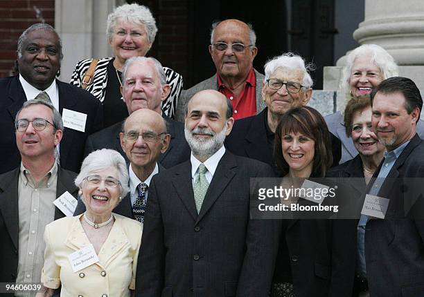 Federal Reserve Chairman Ben S. Bernanke, center, poses with his mother Edna, foreground left, and other family members and friends for a photo on...