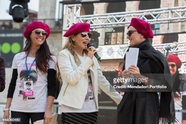 Italian singer Arisa with Giusy Versace and Jo Squillo in piazza Duomo during the event Il futuro Ã© donna for the women's rights conceived by...