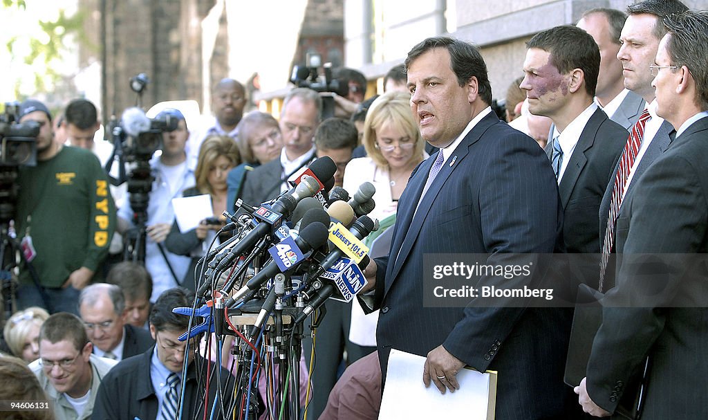 U.S. Attorney Christopher Christie, speaking at podium, hold