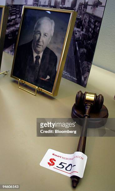 Photo of former Kmart Corp Chief Executive Officer Floyd Hall sits on display during a preview of items to be auctioned from the Kmart corporate art...