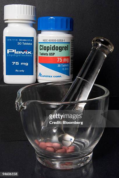Bottle of Plavix heart pills manufactured by Sanofi-Aventis and Bristol-Myers Squibb, is pictured alongside the Apotex generic, Clopidogrel, at...