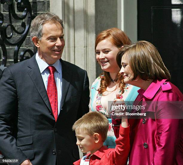 British Prime Minister Tony Blair poses with his family, left to right, Kathryn, Leo, and wife Cherie at 10 Downing Street, before the prime minister...