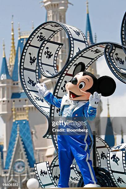 Mickey Mouse waves at guests during a parade at the Magic Kingdom at Walt Disney World in Lake Buena Vista, Florida, Tuesday, May 8, 2007. Walt...