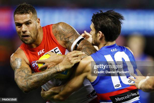 Lance Franklin of the Swans and Easton Wood of the Bulldogs contest the ball during the round four AFL match between the Western Bulldogs and the...