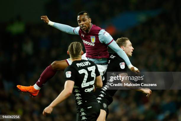 Jonathan Kodjia of Aston Villa competes with Matthew Pennington of Leeds United during the Sky Bet Championship match between Aston Villa and Leeds...