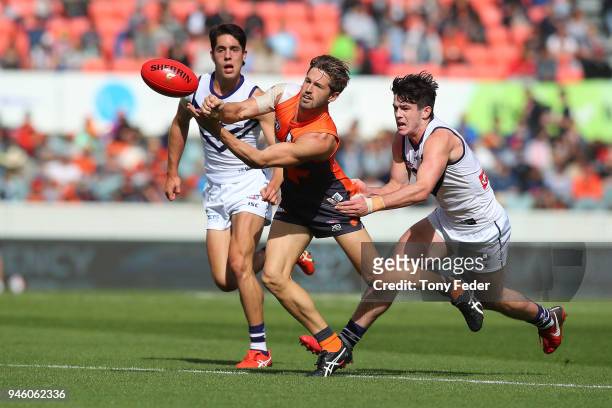 Callan Ward of the Dockers passes the ball during the round four AFL match between the Greater Western Sydney Giants and the Fremantle Dockers at...