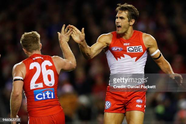 Luke Parker of the Swans celebrates a goal with Josh P. Kennedy of the Swans during the round four AFL match between the Western Bulldogs and the...