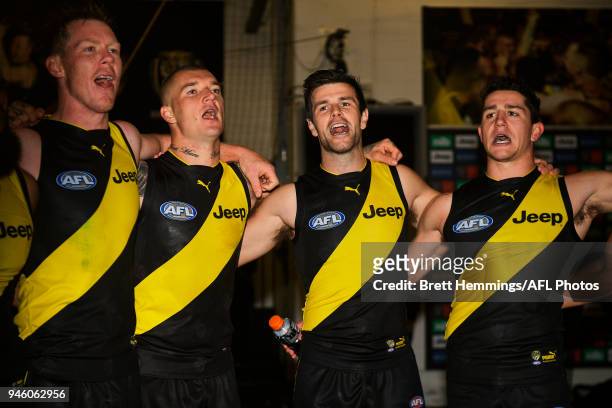 Trent Cotchin of the Tigers celebrates victory with team mates during the round four AFL match between the Richmond Tigers and the Brisbane Lions at...