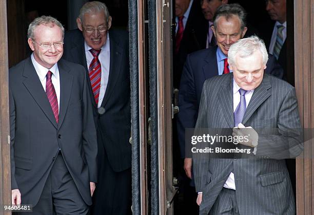 Martin McGuinness, left, Northern Ireland deputy first minister, Ian Paisley, first minister with U.K. Prime Minister, Tony Blair and Irish Prime...