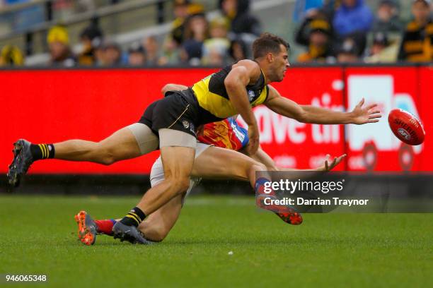 Alex Rance of the Tigers and Mitch Robinson of the Lions compete during the round four AFL match between the Richmond Tigers and the Brisbane Lions...