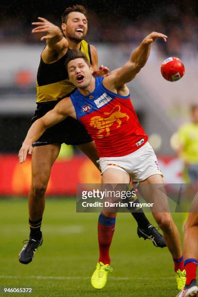 Toby Nankervis of the Tigers and Stefan Martin of the Lions compete in the ruck during the round four AFL match between the Richmond Tigers and the...