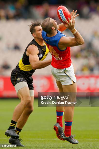 Alex Rance of the Tigers and Josh Walker of the Lions compete during the round four AFL match between the Richmond Tigers and the Brisbane Lions at...