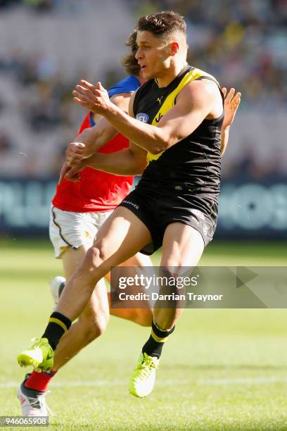 Dion Prestia of the Tigers gets his kick away during the round four AFL match between the Richmond Tigers and the Brisbane Lions at Melbourne Cricket...