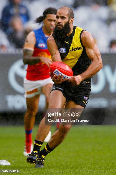 Bachar Houli of the Tigers handballs during the round four AFL match between the Richmond Tigers and the Brisbane Lions at Melbourne Cricket Ground...