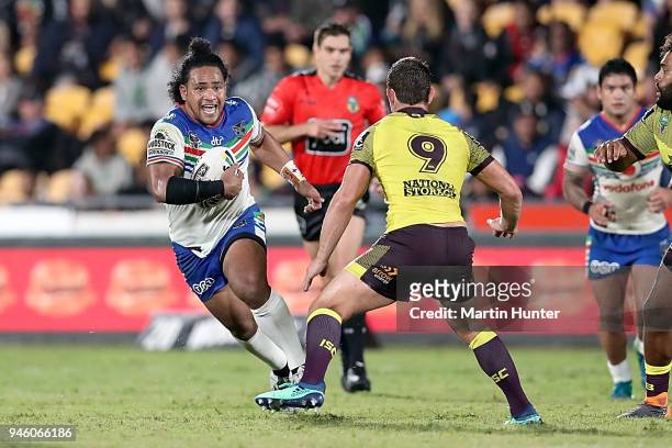 Solomone Kata of the Warriors runs the ball at Andrew McCullough of the Broncos during the round six NRL match between the New Zealand Warriors and...