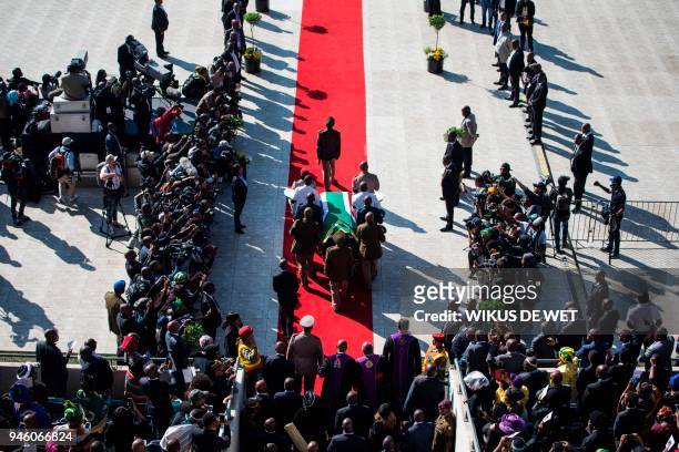 The coffin of Winnie Madikizela-Mandela is carried upon arrival for a funeral ceremony at Orlando Stadium in Soweto on April 14, 2018. South Africa...