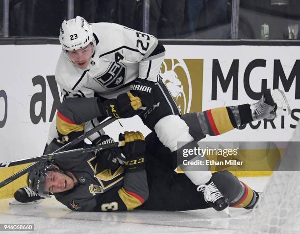 Dustin Brown of the Los Angeles Kings shoves Brayden McNabb of the Vegas Golden Knights down on the ice in the first period of Game Two of the...