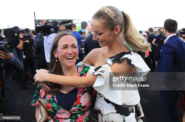 Stephanie Waller, wife of Chris Waller, hugs Christine Bowman after Winx won The Queen Elizabeth Stakes during day two of The Championships as part...