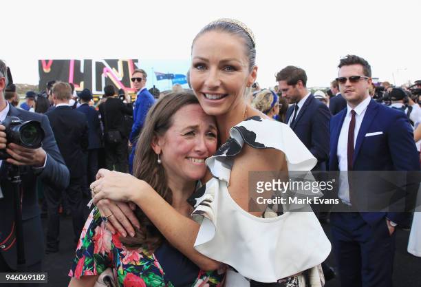 Stephanie Waller, wife of Chris Waller, hugs Christine Bowman after Winx won The Queen Elizabeth Stakes during day two of The Championships as part...