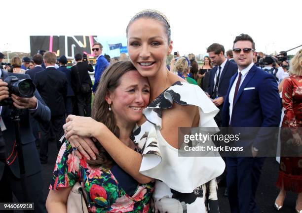 Stephanie Waller, wife of Chris Waller, hugs Christine Bowman after Winx won The Queen Elizabeth Stakes during day two of The Championships as part...