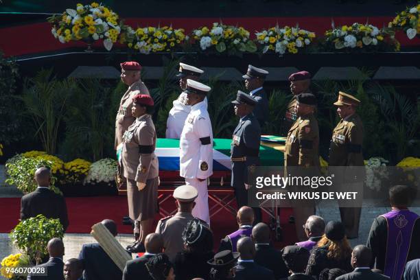 Senior military officials stand by after carrying the coffin of Winnie Madikizela-Mandela into Orlando Stadium in Soweto for a funeral ceremony, as...