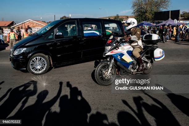 The motorcade transporting the coffin of Winnie Madikizela-Mandela drives through Soweto after leaving her home towards Orlando Stadium for a funeral...
