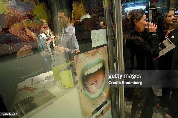 Participants of Hong Kong Art Walk socialize in front of the 82 Republic Gallery in Hong Kong, China, March 7, 2007. One night a year, the Hong Kong...