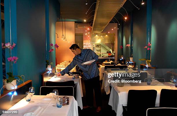 Manager W.H. Sasmito, lays tables atThe Blue Pepper Indonesian restaurant in Amsterdam, The Netherlands, Wednesday, Mar. 7, 2007. Chef Sonja Pereira...