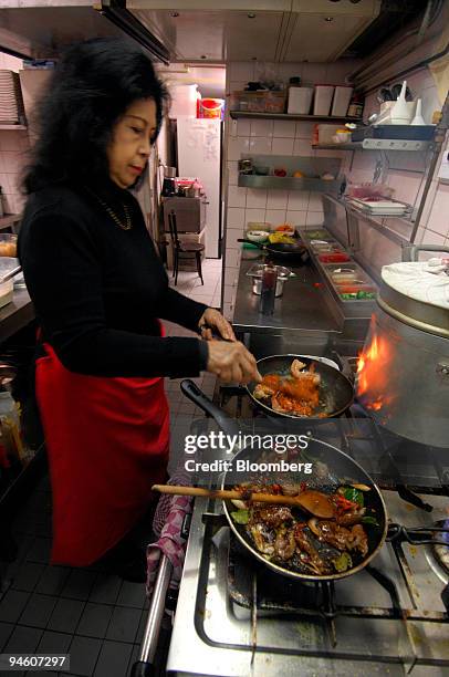 Chef Sonya Pereira Hendarman prepares food at The Blue Pepper Indonesian restaurant in Amsterdam, The Netherlands, Wednesday, Mar. 7, 2007. Chef...