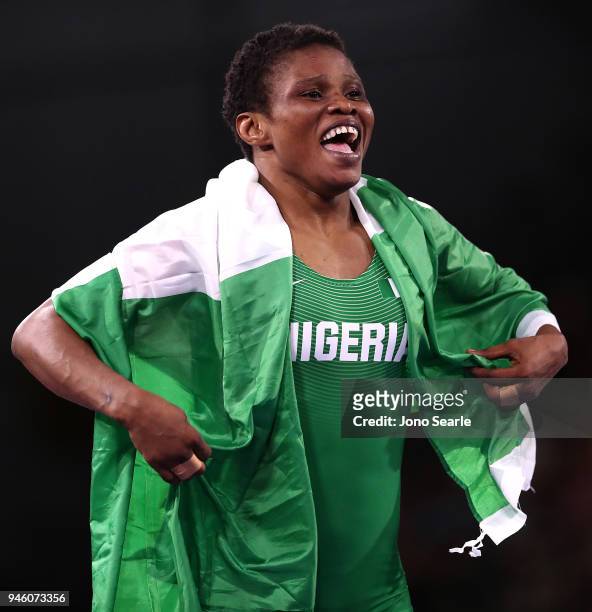 Aminat Adeniyi of Nigeria celebrates winning against Michelle Fazzari of Canada in the women's 62kg Nordic round during Wrestling on day 10 of the...