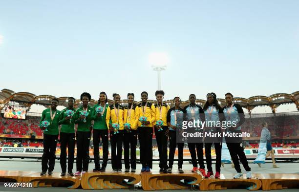 Silver medalists Patience Okon George, Glory Onome Nathaniel, Praise Idamadudu and Yinka Ajayi of Nigeria, gold medalists Janieve Russell, Christine...