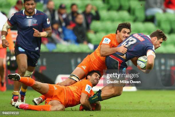 Tom English of the Rebals is tackled during the round nine Super Rugby match between the Rebels and the Jaguares at AAMI Park on April 14, 2018 in...