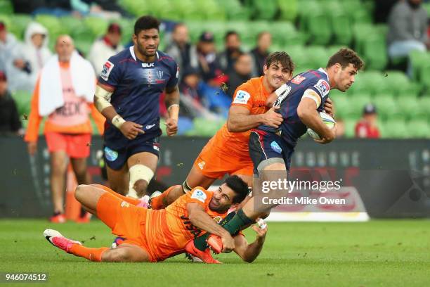 Tom English of the Rebals is tackled during the round nine Super Rugby match between the Rebels and the Jaguares at AAMI Park on April 14, 2018 in...