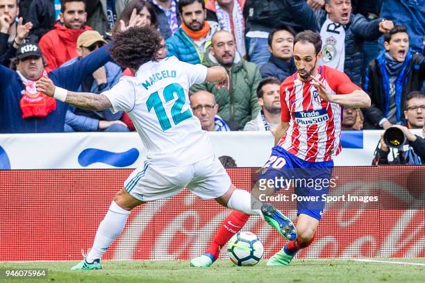 Juan Francisco Torres Belen, Juanfran, of Atletico de Madrid fights for the ball with Marcelo Vieira Da Silva of Real Madrid during the La Liga match...
