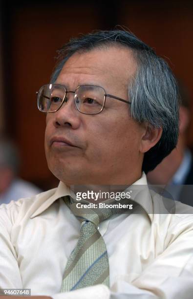DoCoMo Chief Technology Officer Takanori Utano listens during a news conference as part of the Samsung 4G Forum 2006 in Jeju, South Korea in Friday,...
