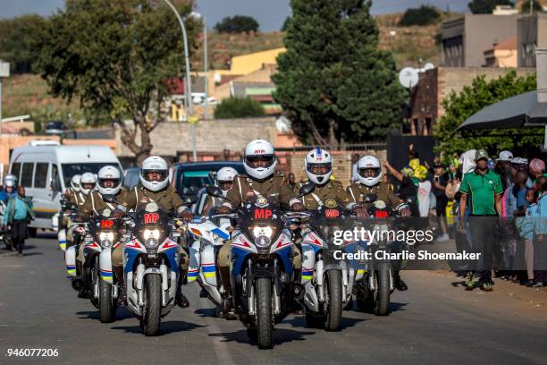 Military Police lead the front of the convoy leading the body of Winnie Mandela to Orlando Stadium for her funeral on April 14 in Soweto, South...