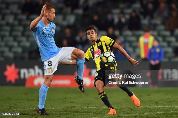 Oliver Bozanic of Melbourne City and Sarpreet Singh of the Phoenix compete for the ball during the round 27 A-League match between the Wellington...