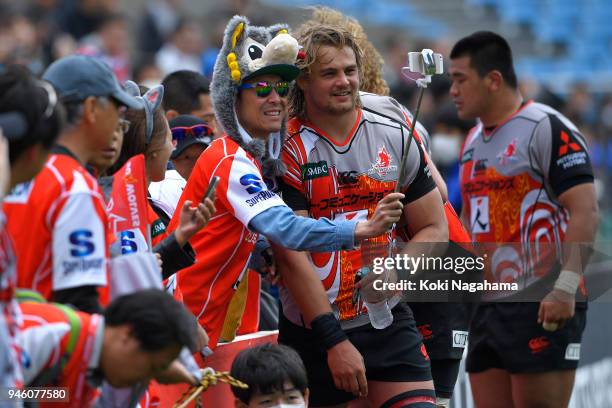 Fan takes a selfie with Wimpie vanderwalt of Sunwolves after the Super Rugby Round 9 match between the Sunwolves and the Blues at the Prince Chichibu...