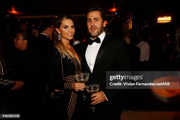 Priscilla Nunes and Tiago Escher attend the 2018 amfAR gala Sao Paulo at the home of Dinho Diniz on April 13, 2018 in Sao Paulo, Brazil.