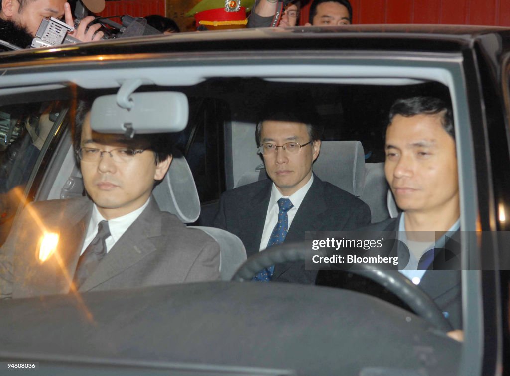Japan's Junichi Ihara, center, is driven away from the North