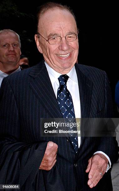 Rupert Murdoch, chairman and chief executive officer of News Corp., leaves the offices of Wachtell, Lipton, Rosen & Katz after meeting with the...
