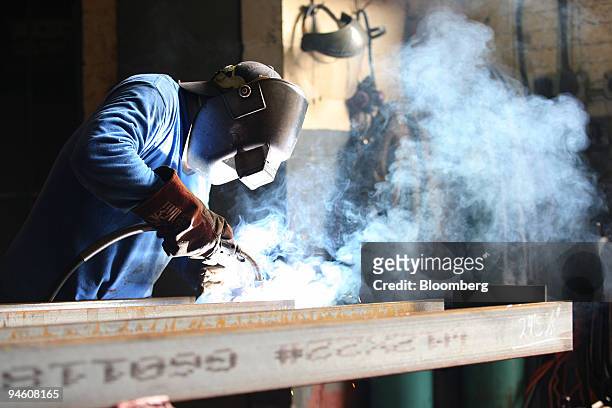 Guillermo Manjarrez welds a steel beam at Barone Steel Fabricators, in Brooklyn, New York, Wednesday, June 14, 2006.