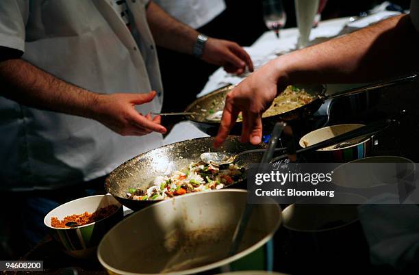 Chefs prepare Free-Form Morel Lasagna with Maine Crab at Todd English's Olive restaurant booth at the 2007 James Beard Foundation awards in New York,...