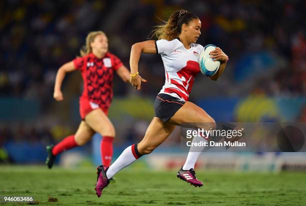 Deborah Fleming of England makes a break to score a try during the Rugby Sevens Women's Pool B match between England and Wales on day 10 of the Gold...