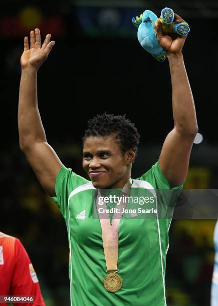 Gold medalist Aminat Adeniyi of Nigeria poses during the medal ceremony for the women's freestyle 50kg event during Wrestling on day 10 of the Gold...