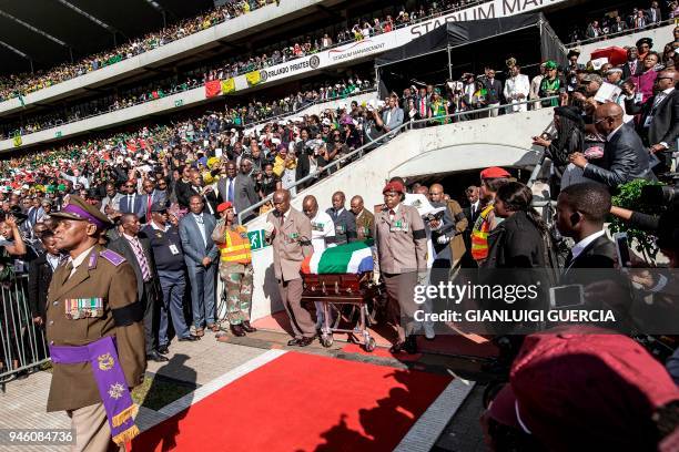 South African military personnel bring in the coffin of Winnie Madikizela-Mandela at Orlando Stadium for the funeral ceremony in Soweto, South Africa...