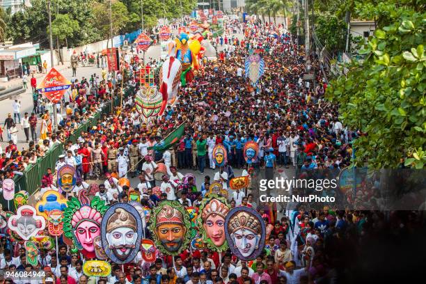 Clad in colourful attires thousands of people and students of the Faculty of Fine Arts of Dhaka University take part in the traditional Mongol...
