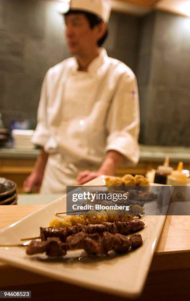 Combination plate of yakitori, salted chicken hearts and gizzards is arranged for a photo at Ariyoshi restaurant, located at Broadway at 12th Street...