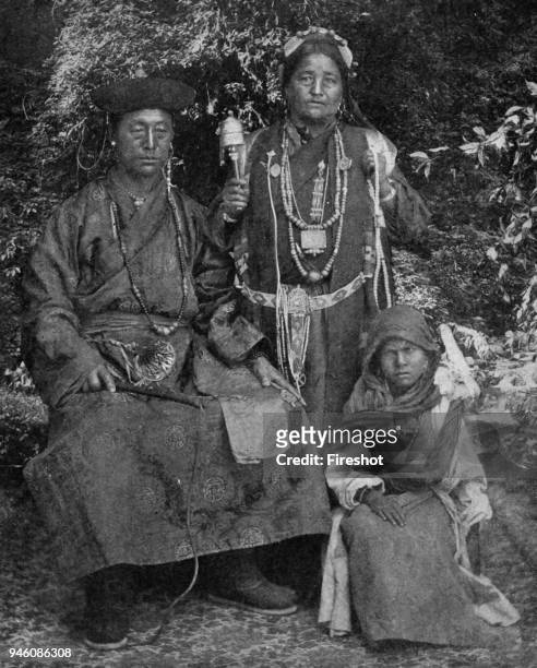 Historical Geography. 1900. India. A family photograph of Sikkim Bhotias of Tibetan origin, displays paternal authority with its formidable whip,...