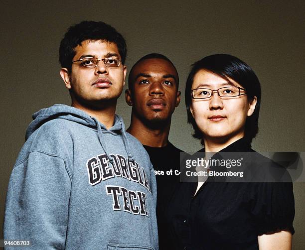Rishi Dhingra, left to right, Jay Anderson, and Qiushuang Zhang, students at Georgia Institute of Technology, pose on campus in Atlanta, in May, 2007.
